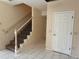 Light-filled entryway showcasing staircase and marble tile floors at 402 E Maple St, Winter Garden, FL 34787