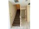 Light-filled entryway features stairs, a white door, and marble tile flooring at 402 E Maple St, Winter Garden, FL 34787