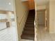 Open entryway featuring a staircase, marble floors, and natural light at 402 E Maple St, Winter Garden, FL 34787