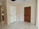 Welcoming entryway features marble tile floors, and convenient access to multiple rooms at 402 E Maple St, Winter Garden, FL 34787