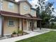 Charming two-story home with a covered front porch and seating at 402 E Maple St, Winter Garden, FL 34787