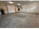 Spacious garage with concrete floor, white walls, and overhead lighting at 402 E Maple St, Winter Garden, FL 34787
