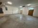 Empty garage with concrete flooring and basic utilities at 402 E Maple St, Winter Garden, FL 34787