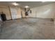 Spacious garage with concrete floor, white walls, and overhead lighting at 402 E Maple St, Winter Garden, FL 34787