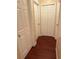 Hallway featuring wood-look floors and several doors at 402 E Maple St, Winter Garden, FL 34787