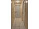 Hallway with ceramic flooring and white doors at 402 E Maple St, Winter Garden, FL 34787