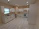Bright kitchen featuring white cabinets and appliances at 402 E Maple St, Winter Garden, FL 34787