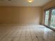 Large living room featuring bright natural light, neutral walls, and tile flooring at 402 E Maple St, Winter Garden, FL 34787