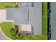 Aerial view of the property showcasing the backyard, screened patio, roof, landscaping, and lawn at 425 Glen Arbor Ln, Leesburg, FL 34748