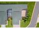 Overhead shot of the roof and screen porch, surrounded by green lawns and mature landscaping at 425 Glen Arbor Ln, Leesburg, FL 34748