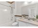 Bright bathroom featuring a tub/shower combo and a vanity with ample counter space at 425 Glen Arbor Ln, Leesburg, FL 34748