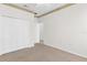 Bedroom with neutral carpet, full closet, decorative trim at 425 Glen Arbor Ln, Leesburg, FL 34748
