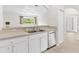 Well-equipped kitchen with stainless steel dishwasher and ample countertop space at 425 Glen Arbor Ln, Leesburg, FL 34748