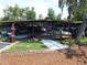 Well-maintained covered boat storage docks with landscaped surroundings at 432 Santa Fe E Rd, Tavares, FL 32778
