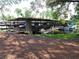 Community boat storage with multiple covered boat slips at 432 Santa Fe E Rd, Tavares, FL 32778