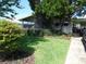 Charming home featuring a well-kept lawn and attractive landscaping at 432 Santa Fe E Rd, Tavares, FL 32778