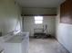 This laundry room has a washer and dryer, with a peg board on the wall at 432 Santa Fe E Rd, Tavares, FL 32778