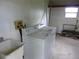 Functional laundry room with a utility sink and standard washer and dryer hookups at 432 Santa Fe E Rd, Tavares, FL 32778