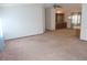 Spacious living room featuring neutral carpet, ceiling fan and light fixture at 432 Santa Fe E Rd, Tavares, FL 32778