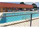 Community pool, partially fenced with plenty of lounge chairs for residents at 432 Santa Fe E Rd, Tavares, FL 32778