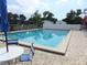 Well-maintained community pool with surrounding patio and seating at 432 Santa Fe E Rd, Tavares, FL 32778