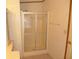 The bathroom features a glass shower enclosure and patterned wallpaper at 432 Santa Fe E Rd, Tavares, FL 32778