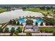 Aerial view showcasing the community pool and lake at 4701 Nw 51St Terrace Rd, Ocala, FL 34482