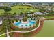 The aerial view showcases the pool, clubhouse, tennis courts, and golf course at 4701 Nw 51St Terrace Rd, Ocala, FL 34482