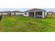 A spacious, well-maintained backyard with lush green grass, perfect for outdoor activities at 4701 Nw 51St Terrace Rd, Ocala, FL 34482