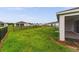 This expansive backyard has healthy green grass, a black fence and neighboring homes at 4701 Nw 51St Terrace Rd, Ocala, FL 34482