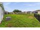 A large backyard is perfect for outdoor entertaining with its lush green grass and black fencing at 4701 Nw 51St Terrace Rd, Ocala, FL 34482
