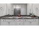 Bathroom featuring double sinks and granite countertops, with a walk-in shower at 4701 Nw 51St Terrace Rd, Ocala, FL 34482