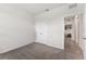 Neutrally decorated bedroom with carpet and access to the home's hallway at 4701 Nw 51St Terrace Rd, Ocala, FL 34482