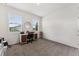 Bright bedroom with neutral carpet, a stylish desk, and natural light at 4701 Nw 51St Terrace Rd, Ocala, FL 34482