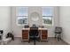 Bright bedroom with neutral carpet, a stylish desk, and natural light at 4701 Nw 51St Terrace Rd, Ocala, FL 34482