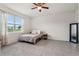 Bright bedroom with large window offers a cozy space with neutral tones and tile floors at 4701 Nw 51St Terrace Rd, Ocala, FL 34482