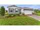 Charming one-story home with a brick driveway, manicured lawn, and professionally designed landscaping at 4701 Nw 51St Terrace Rd, Ocala, FL 34482