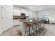Kitchen island with barstool seating and modern appliances at 4701 Nw 51St Terrace Rd, Ocala, FL 34482