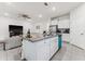 Bright kitchen boasts granite counters, stainless appliances, and an island open to the living area at 4701 Nw 51St Terrace Rd, Ocala, FL 34482
