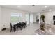 Open concept dining area features sliding glass doors to the lanai and lots of natural light at 4701 Nw 51St Terrace Rd, Ocala, FL 34482