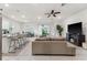 Open-concept living room with comfortable seating and sliding doors to the outdoors at 4701 Nw 51St Terrace Rd, Ocala, FL 34482