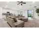 Bright living room with a spacious sectional and sliding glass doors at 4701 Nw 51St Terrace Rd, Ocala, FL 34482