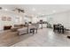 Open floor plan with kitchen island, dining table, and spacious living room at 4701 Nw 51St Terrace Rd, Ocala, FL 34482