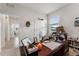 Cluttered home office, showing the connection to other rooms of the home at 4701 Nw 51St Terrace Rd, Ocala, FL 34482