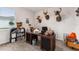 Spacious office with dark wood desk, neutral carpet, and deer mount decor at 4701 Nw 51St Terrace Rd, Ocala, FL 34482