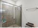 Modern shower with tile surround, glass door, and recessed niche at 4701 Nw 51St Terrace Rd, Ocala, FL 34482