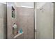 Modern shower with tile surround, glass door, and recessed niche at 4701 Nw 51St Terrace Rd, Ocala, FL 34482
