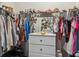 Walk-in closet features ample storage space with rods and shelves, plus a vanity at 4701 Nw 51St Terrace Rd, Ocala, FL 34482