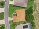 Overhead shot displaying the home's roof, landscaping, and its proximity to the street and nearby pool at 4826 Sable Ridge Ct, Leesburg, FL 34748