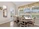 Eat-in kitchen dining with bright windows overlooking the backyard at 4826 Sable Ridge Ct, Leesburg, FL 34748
